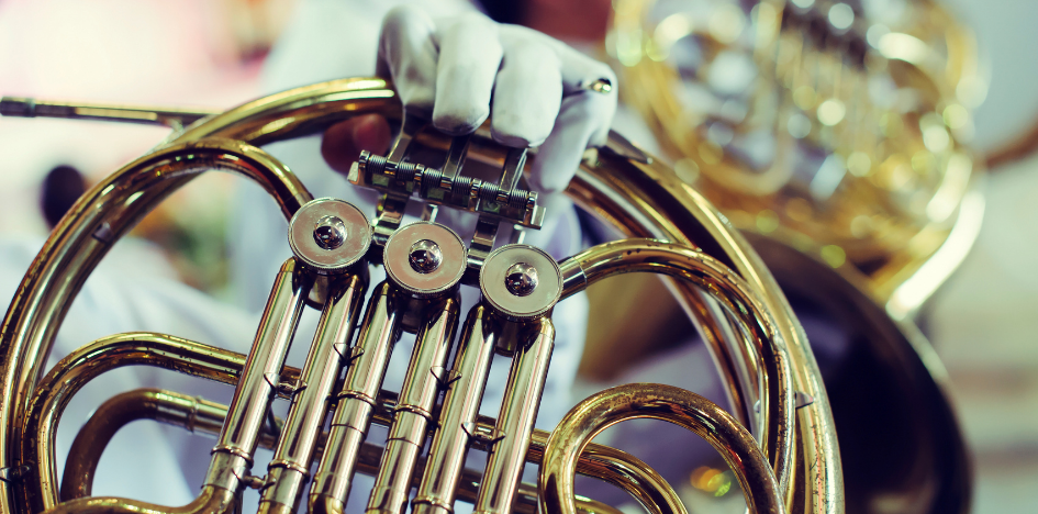 Bandmember holding horn