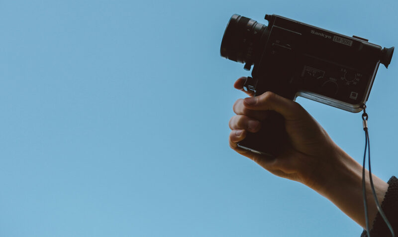 image of someone holding a film camera