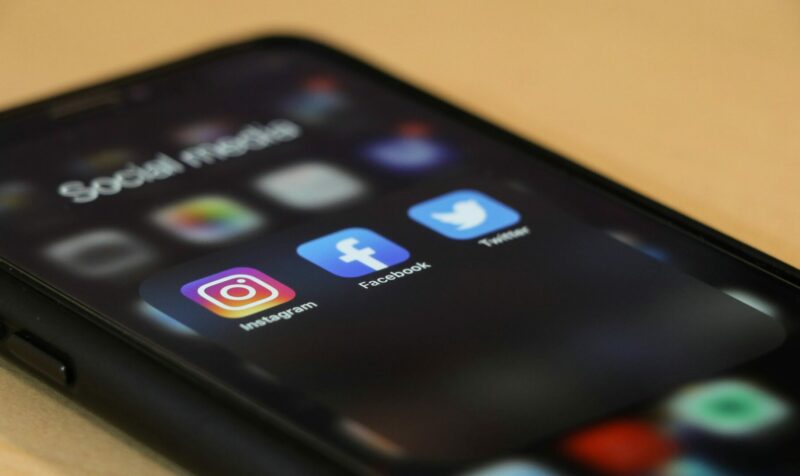 Photograph of phone with social media apps