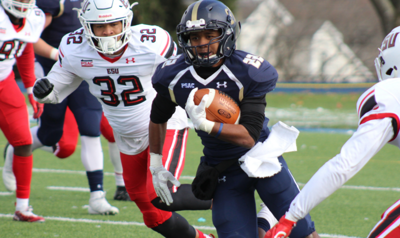 football player running with a football