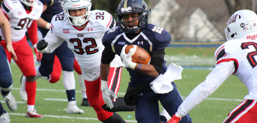 football player running with a football