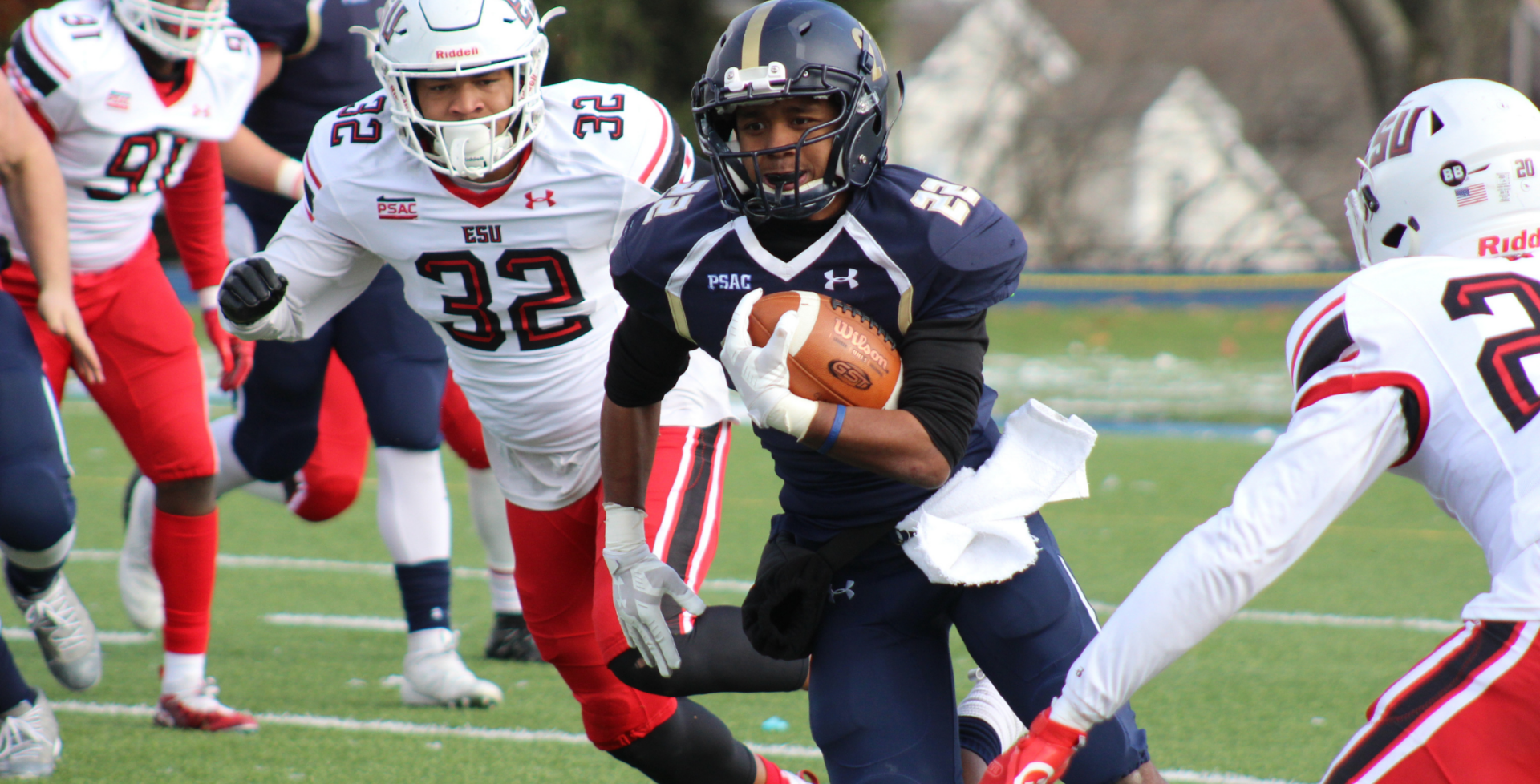 football player running with a football